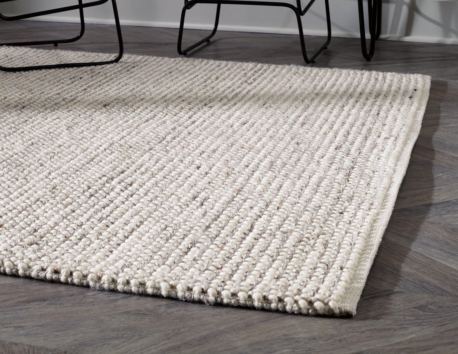 Jossick 7'8" x 10' Rug - Luxury Home Furniture (MI)