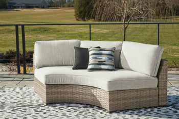 Calworth Outdoor Curved Loveseat with Cushion - Luxury Home Furniture (MI)
