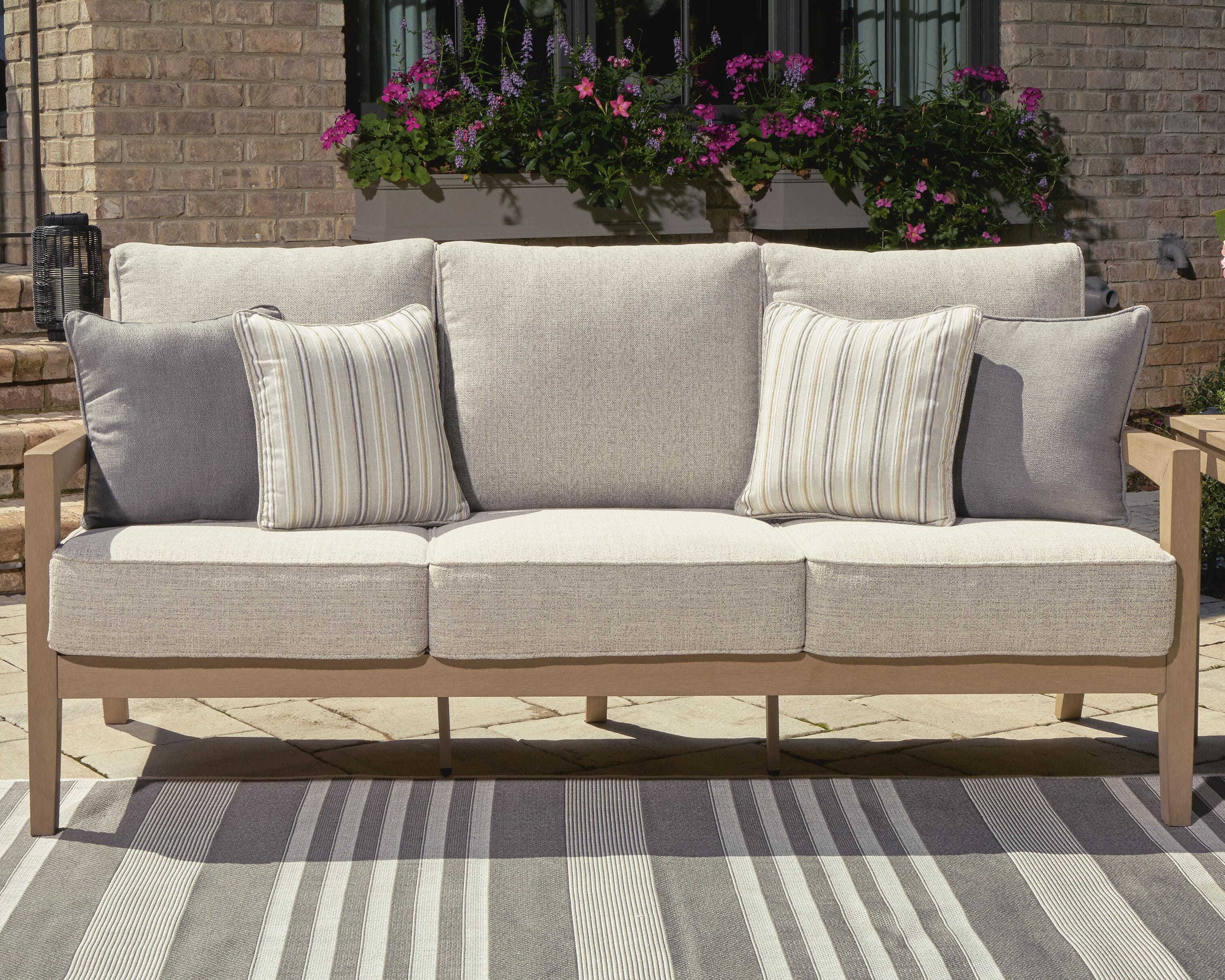Hallow Creek Outdoor Sofa with Cushion - Luxury Home Furniture (MI)